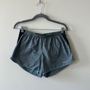 Blue and black specked Nike running shorts